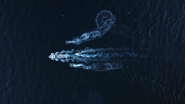 Aerial video of a group of boats sailing the sea off the island of Ibiza.