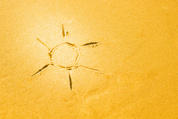 Sun drawing made on a sandy beach
