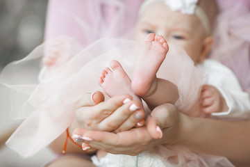 Little cute baby`s feet closeup photo