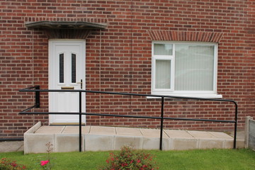 Disabled access  wheelchair ramp on front elevation of a  UK house - 372890611