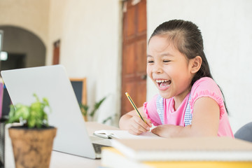 asian girl student online learning study online with video call teacher. social distance during quarantine, self-isolation, online education concept, homeschool, stay at home entertainment.