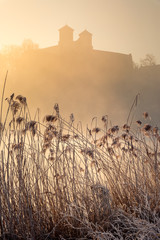 Tyniec abbey in morning fog in sunrise time. Cracow, Malopolska, Poland 