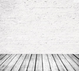 Interior room with white brick wall and wooden floor