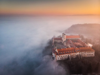 Drone aerial photo of Tyniec Abbey in mist near Krakow in Malopolska, Poland 
