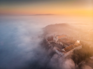 Drone aerial photo of Tyniec Abbey in mist near Krakow in Malopolska, Poland 