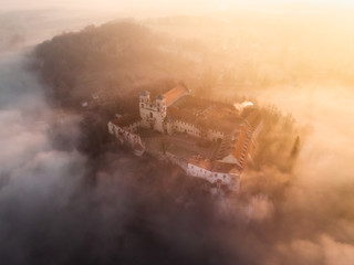 Drone aerial photo of Tyniec Abbey in mist near Krakow in Malopolska, Poland 
