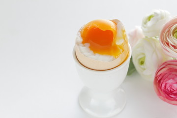 soft boiled egg in egg stand for breakfast 