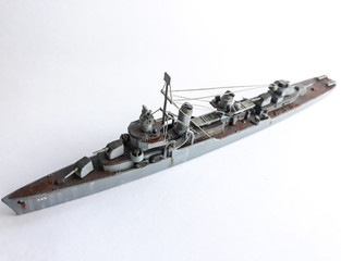 Plastic model toy ship against white background