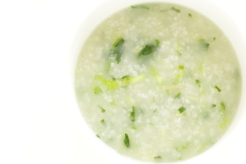 Chinese food, spinach and rice porridge in white bowl