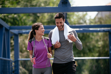 Athletic couple jogging in the city. Happy couple training outdoors..