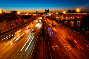Fototapeta na wymiar Night in the big city. Traffic in the night metropolis.