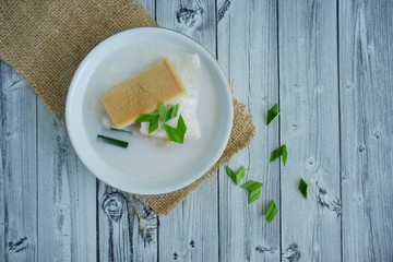 Pis Roti is Indonesian traditional food made from white bread boiled with coconut milk, sugar and...