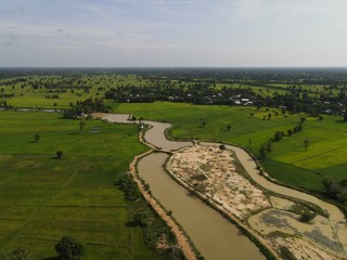 Fototapeta na wymiar High angle shot river with rice field landscape.