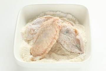 Homemade Korean food, prepared flour and marinated chicken wing for fried chicken cooking