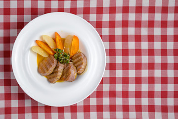 Fresh grilled steaks with mango fruit pieces. Meat dish. Healthy delicious dinner. Healthy diet.