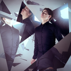 Man surrounded by floating mirror shards