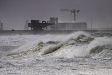 Fototapeta na wymiar Harbor wall during heavy storm