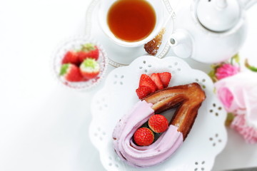 strawberry chocolate churros and fruit on dish for gourmet dessert