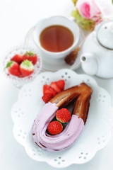 strawberry chocolate churros and fruit on dish for gourmet dessert