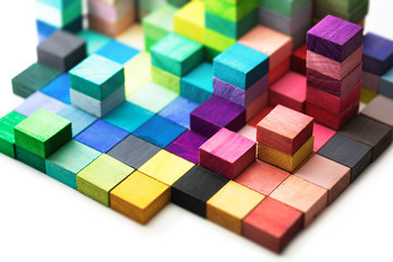 Spectrum of stacked multi-colored wooden blocks. Background or cover for something creative,...