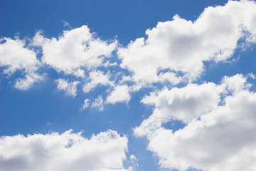 white clouds on the blue clear sky