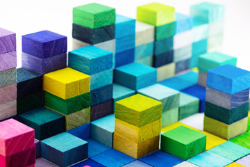 Spectrum of stacked multi-colored wooden blocks. Background or cover for something creative,...