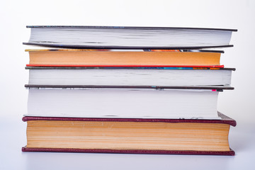 Stack of books on white background