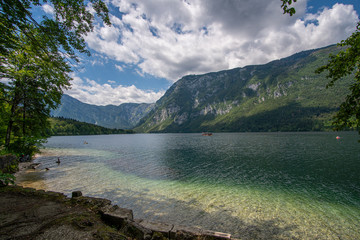 the beautiful lake Bohinj in Slovenia with the mountains in the back