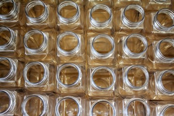 Clean plastic bottles stacked in a factory.
