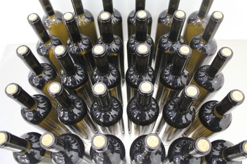 Glass bottles stacked in a wine factory.