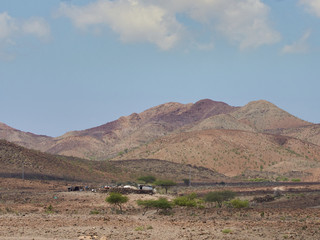 Djibouti country side. A homestead by a barren mountain