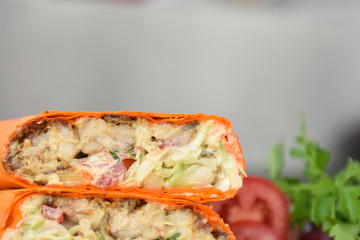 kebab meat with vegetables on a wheat tortilla