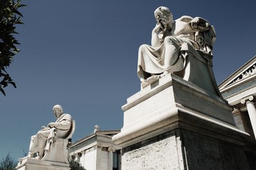 Fototapeta na wymiar View of the statues of the ancient Greek philosophers Plato and Socrates in Athens, Greece, June 17 2020.