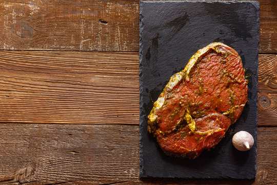 raw meat on a cutting board