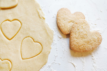 two heart shaped cookies made with natural ingredients on white table