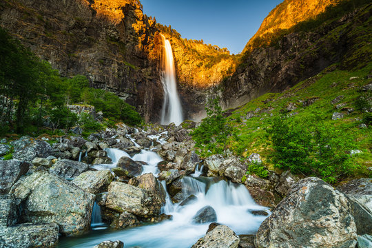 Beautiful Norwegian waterfall at sunset