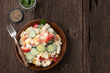 space cucumber vegetable salad in wood plate food background