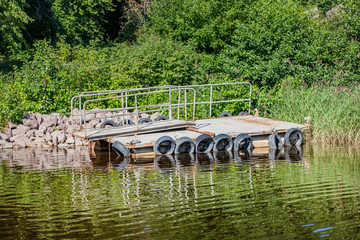 Abandoned metal panton near the shore