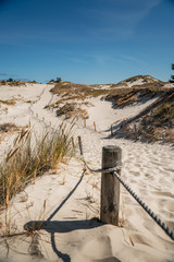 Rope railing on sandy beach - Leba, Poland