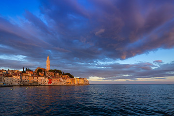 Wonderful morning view of old  Rovinj town with multicolored buildings and yachts moored along embankment, Croatia.