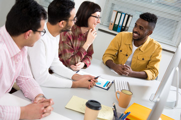 Fototapeta premium Multy-ethnic group of creative business people working with computer at office