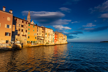 Wonderful morning view of old  Rovinj town with multicolored buildings and yachts moored along embankment, Croatia.