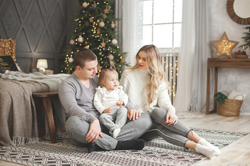 Obraz premium Adorable loving family on christmas background