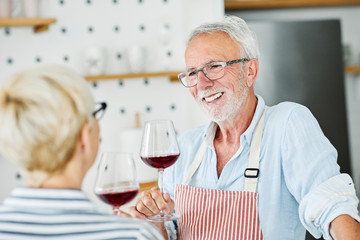 love kitchen senior glass man couple home retirement happy food smiling husband wine together portrait
