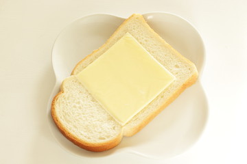 Sliced cheese on bread for breakfast