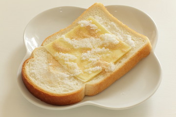 sliced cheese and sugar on toast for asian broakfast