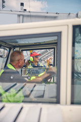 Truck driver looking at his male colleague