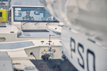 Focused operator sitting in a ground vehicle