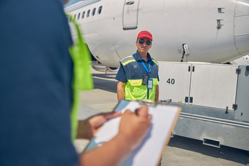 Smiling airport worker posing for the camera