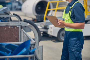 Airport employee in uniform at the airdrome